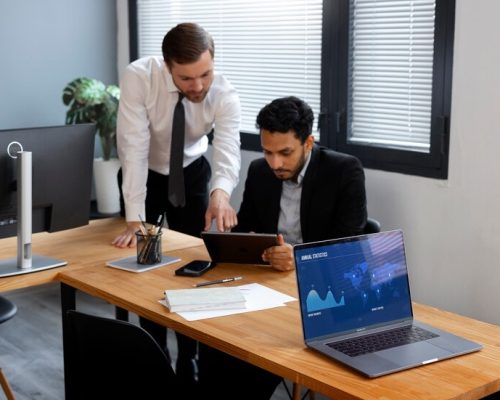 business-person-looking-finance-graphs_23-2150461314