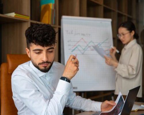 office-workers-using-finance-graphs_23-2150408665