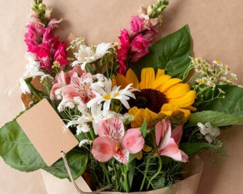 top-view-bouquet-flowers-with-blank-card_23-2149024547